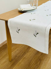 Load image into Gallery viewer, White linen table runner, delicately embroidered with lily of the valley flowers