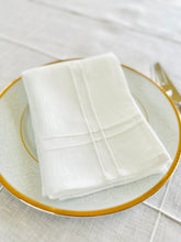 Load image into Gallery viewer, Pleated off white linen napkins — timeless, sustainable, and beautifully textured for your minimalist table setting. Their minimalist design suits neutral homes, eco-friendly interiors, and modern table decor beautifully.