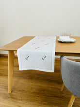 Load image into Gallery viewer, White linen table runner, delicately embroidered with lily of the valley flowers