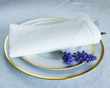 Ielādēt attēlu galerijas skatītājā, Bring classic beauty to your meals with these white linen dinner napkins crafted from premium European linen. Each napkin measures 17×17 in (43×43 cm) and features an understated yet refined hemstitched finish — an elegant detail that frames your place setting with craftsmanship and care.