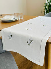 Load image into Gallery viewer, White linen table runner, delicately embroidered with lily of the valley flowers