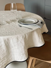 Load image into Gallery viewer, Create and enjoy beautiful moments on holidays and every day with our classic linen collection for table setting.
Round linen tablecloth with tailored black ribbon edge.
Washed linen round tablecloth.
Color: Moonlight white (Off White).
Composition: 100% linen, weight g/m2: 190 +/-20.