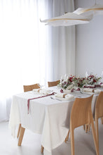 Ielādēt attēlu galerijas skatītājā, Luxurious linen tablecloth handcrafted from washed linen. The tablecloth is decorated with 4 cm wide flap.
Size: 170x170 cm and 170x270 cm.
Color: Off White.