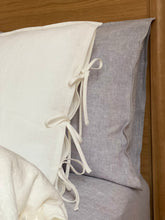 Load image into Gallery viewer, The main decorative element of the SKINNY TIES linen pillowcase are same material tailored 1 cm wide narrow cords at the side of pillowcase.
Bow ties and envelope closure.
Linen bedding creates a refined yet lived-in look that never goes out of style.