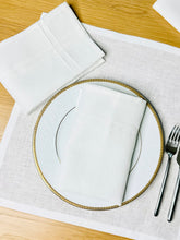 Load image into Gallery viewer, Pleated off white linen napkins — timeless, sustainable, and beautifully textured for your minimalist table setting. Their minimalist design suits neutral homes, eco-friendly interiors, and modern table decor beautifully.
