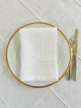 Load image into Gallery viewer, Pleated off white linen napkins — timeless, sustainable, and beautifully textured for your minimalist table setting. Their minimalist design suits neutral homes, eco-friendly interiors, and modern table decor beautifully.
