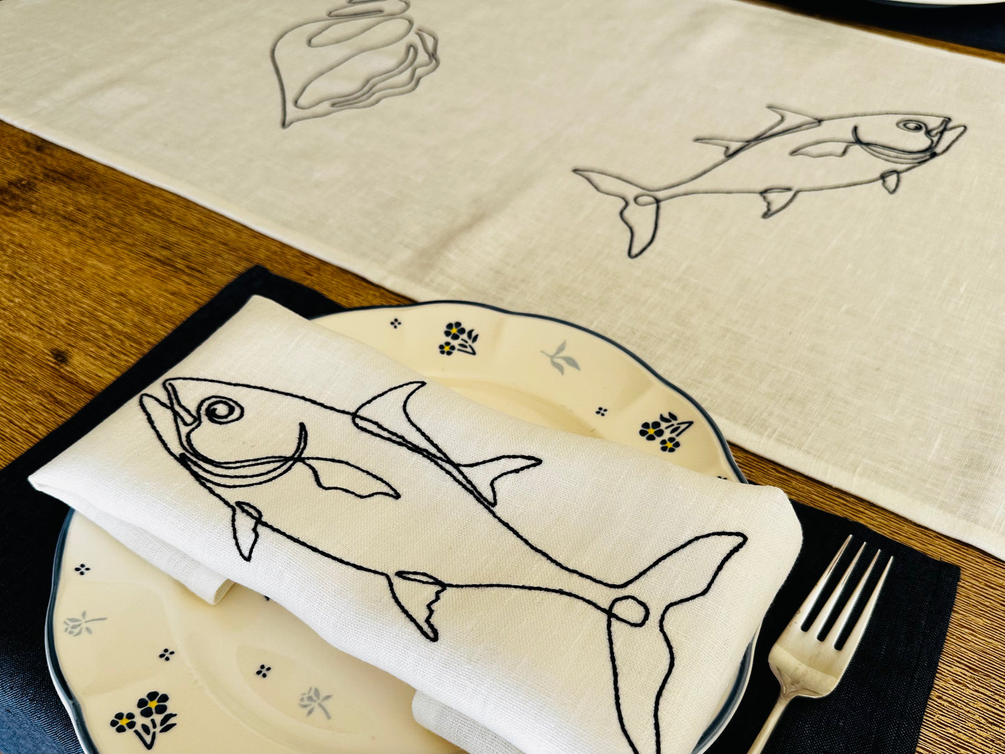 linen napkin with fish embroidery
