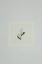 Load image into Gallery viewer, Bring quiet, botanical elegance to your table with these linen coasters embroidered with lily of the valley. Made from natural European linen, they protect surfaces beautifully while adding a refined spring-floral detail. Perfect for coffee moments, hosting, and thoughtful gifting.
