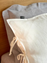 Load image into Gallery viewer, The main decorative element of the SKINNY TIES linen pillowcase are same material tailored 1 cm wide narrow cords at the side of pillowcase.

Bow ties and envelope closure.

Linen bedding creates a refined yet lived-in look that never goes out of style.
