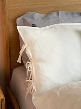 Load image into Gallery viewer, The main decorative element of the SKINNY TIES linen pillowcase are same material tailored 1 cm wide narrow cords at the side of pillowcase.

Bow ties and envelope closure.

Linen bedding creates a refined yet lived-in look that never goes out of style.
