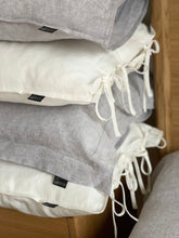 Load image into Gallery viewer, The main decorative element of the SKINNY TIES linen pillowcase are same material tailored 1 cm wide narrow cords at the side of pillowcase.

Bow ties and envelope closure.

Linen bedding creates a refined yet lived-in look that never goes out of style.

